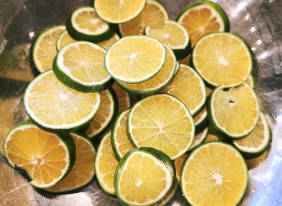 Cross-sections of sliced green tangerines