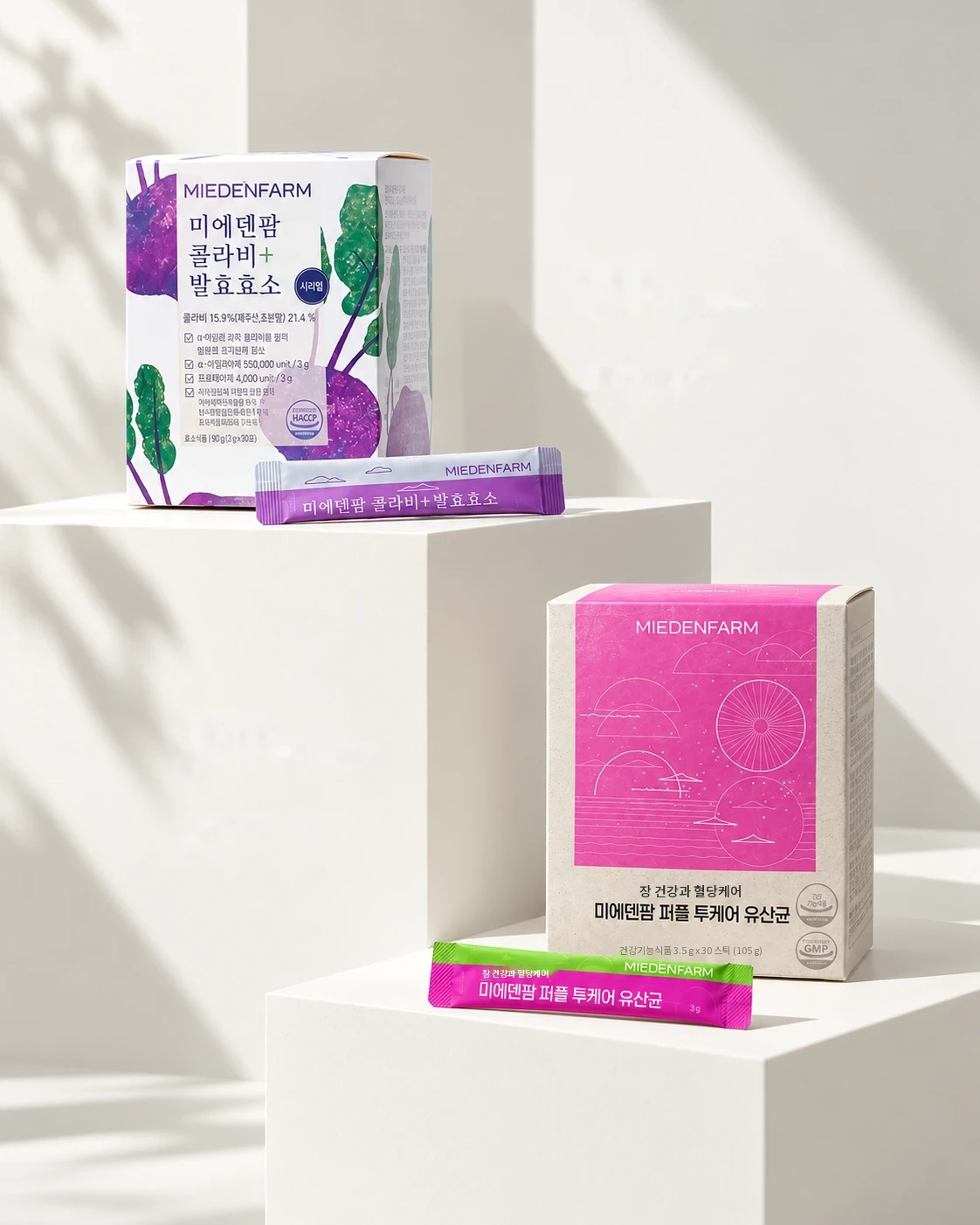 Kohlrabi+ Fermented Enzyme and Purple TwoCare Probiotics boxes on white stands