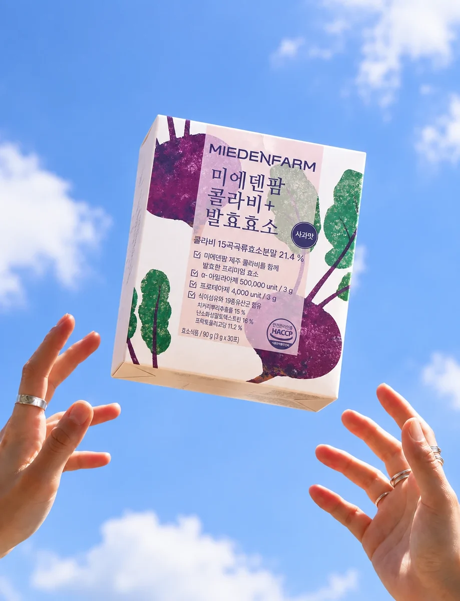 A MIEDEN FARM Kohlrabi+ Fermented Enzyme box floating above a hand raised to the sky