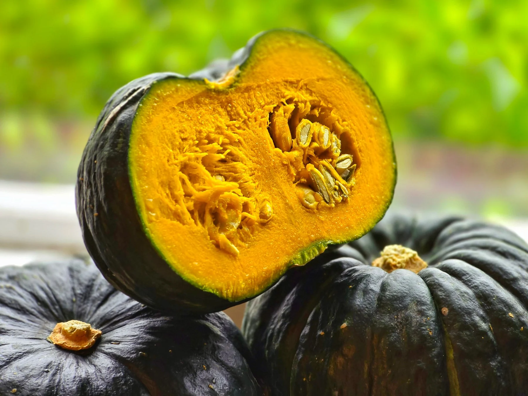The yellow flesh of a halved mini kabocha (photo by MIEDEN FARM)
