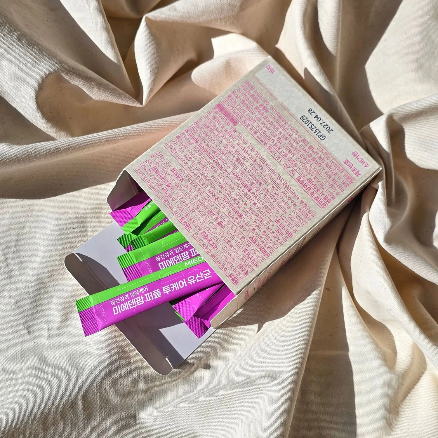 A Purple TwoCare Probiotics box with sticks (photo by MIEDEN FARM)